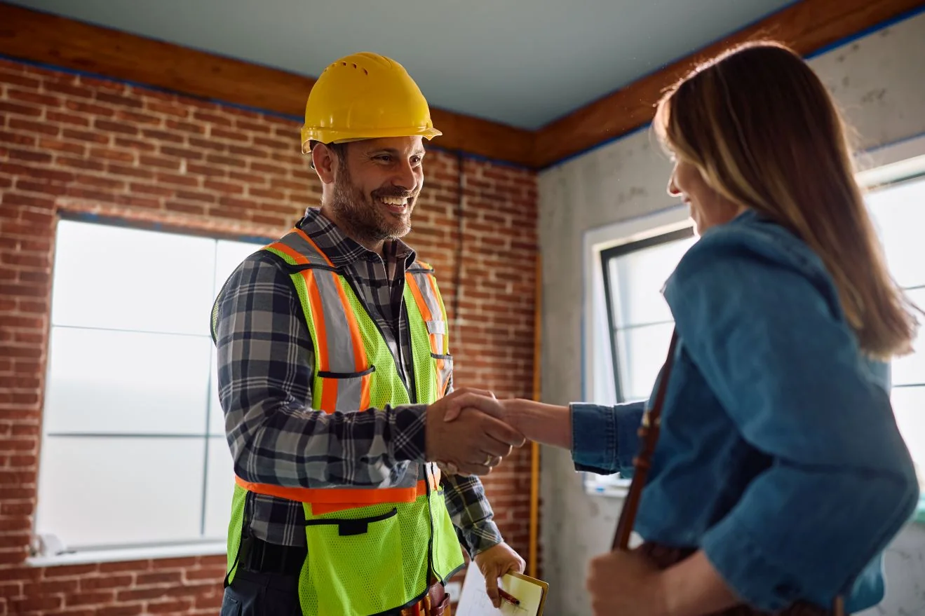Contractor shaking hands with a homeowner