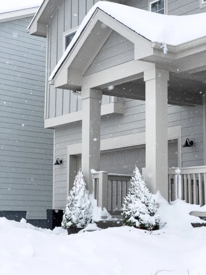 Snow covered house entrance in winter